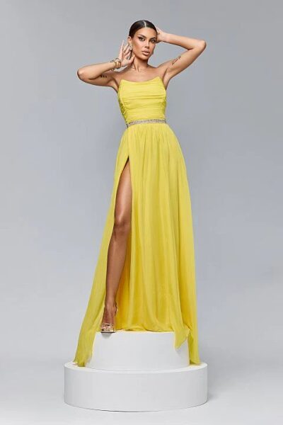 Elegante abito lungo in tessuto velato con corpino